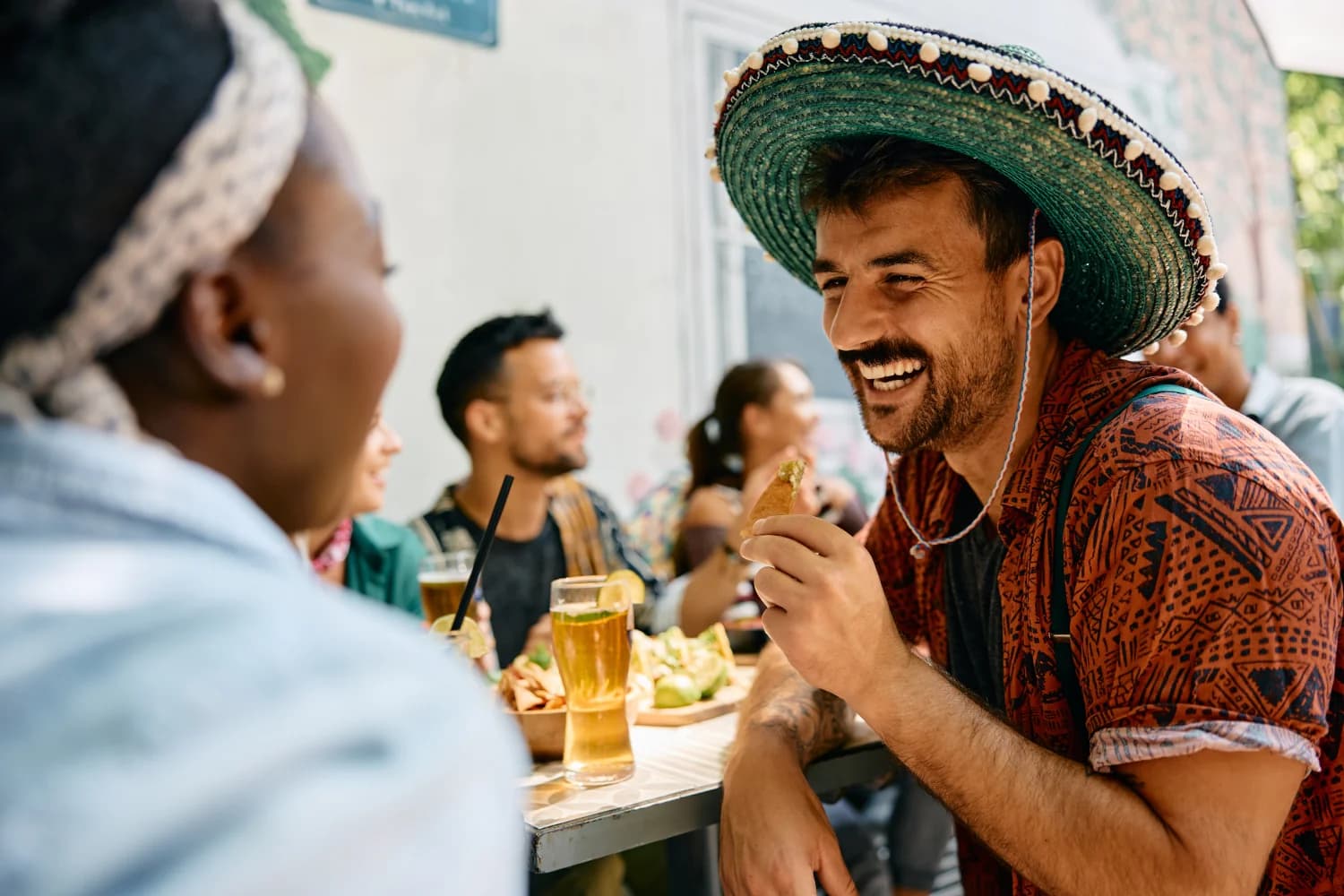 https://cf.digitalpotter.io/tenants/6a0770c0802690ed02b35af6/plitz/596e47635c82 cheerful man eating nacho chips and drinking beer